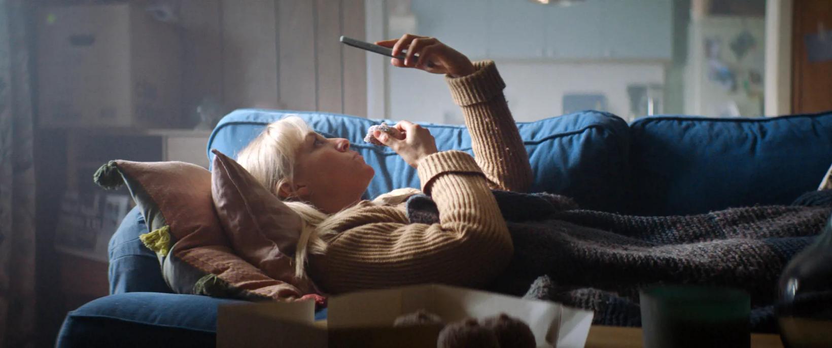a person lying on a couch