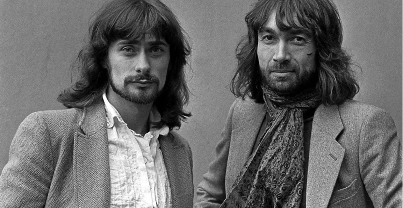 two men with long hair