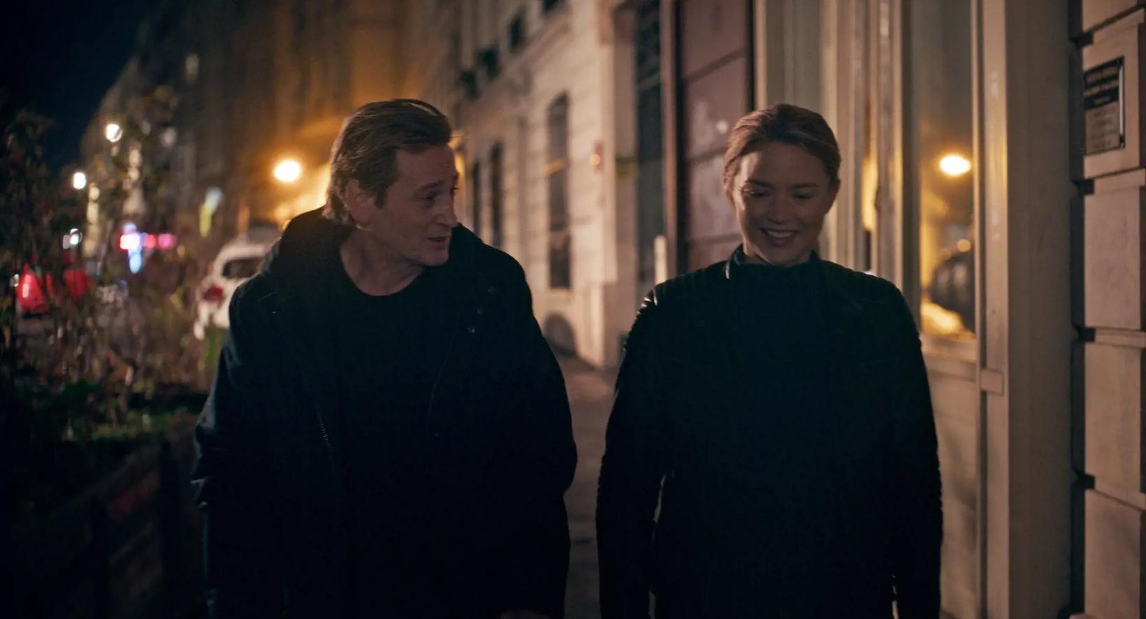 Virginie Efira and woman standing next to each other outside at night