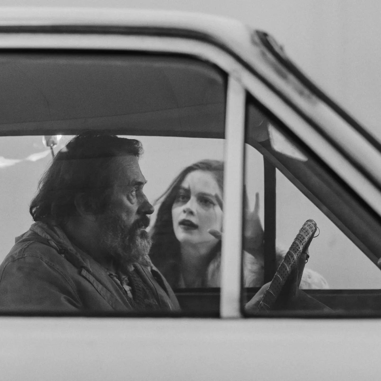 a man and woman in a car