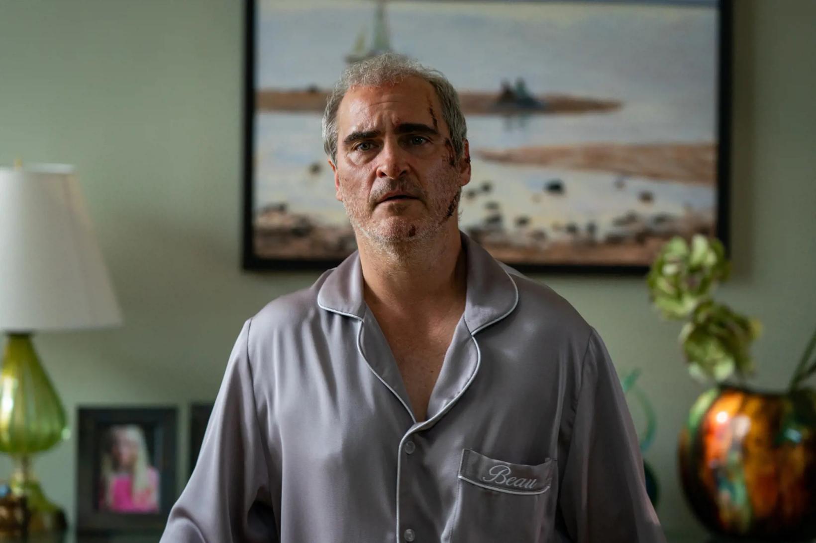 Joaquin Phoenix standing in a room
