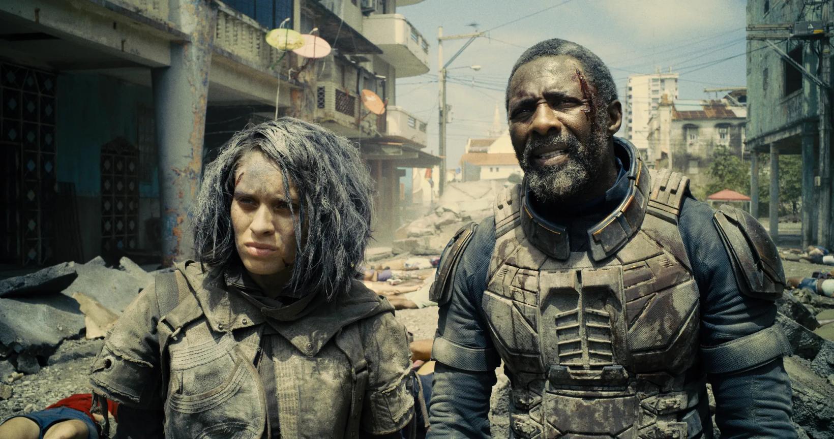 a man and woman standing in a street