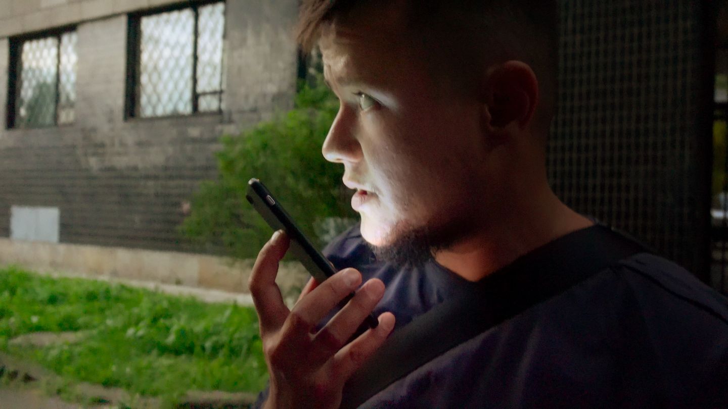 a man talking on a cell phone