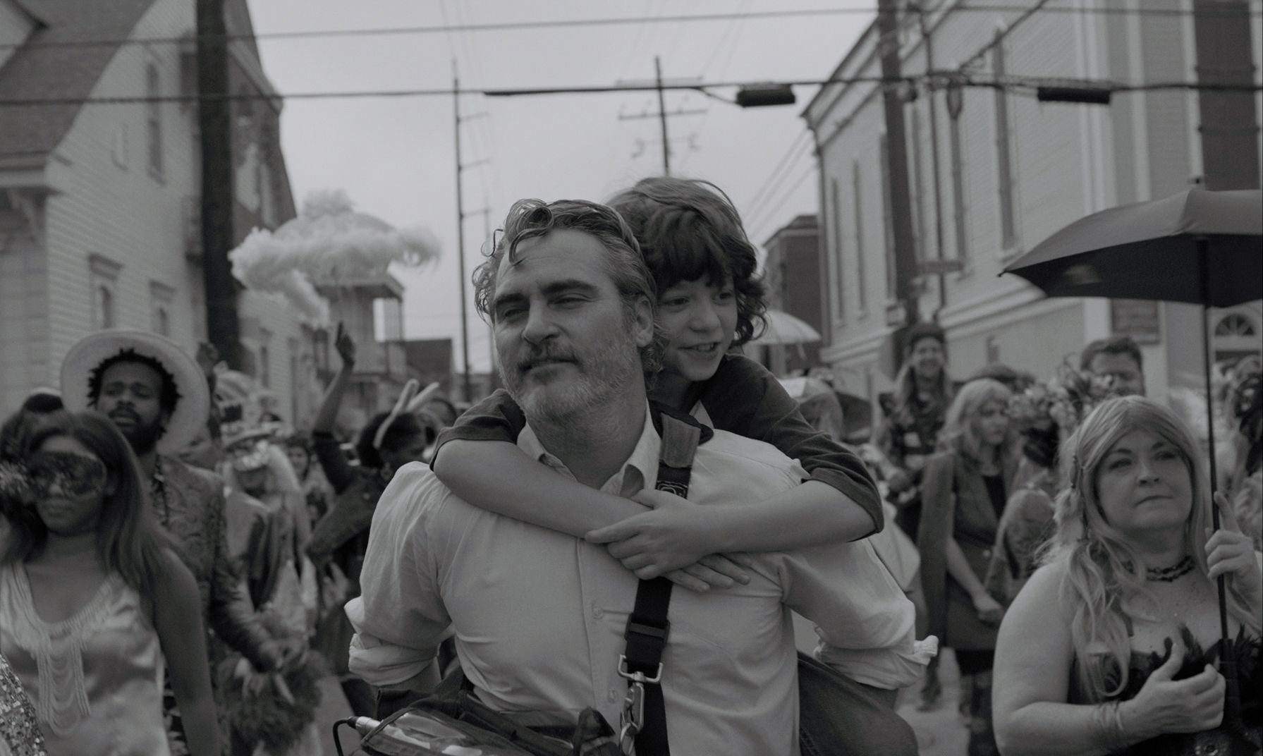 Joaquin Phoenix holding a woman