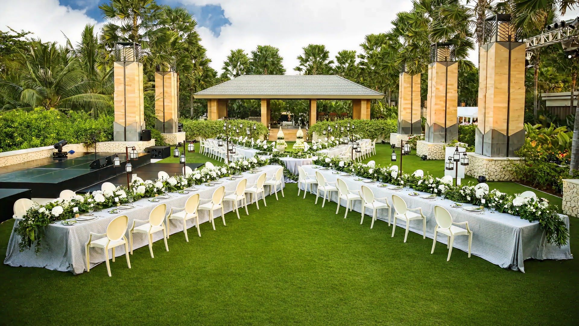 outdoor wedding hall with white and green floral decoration