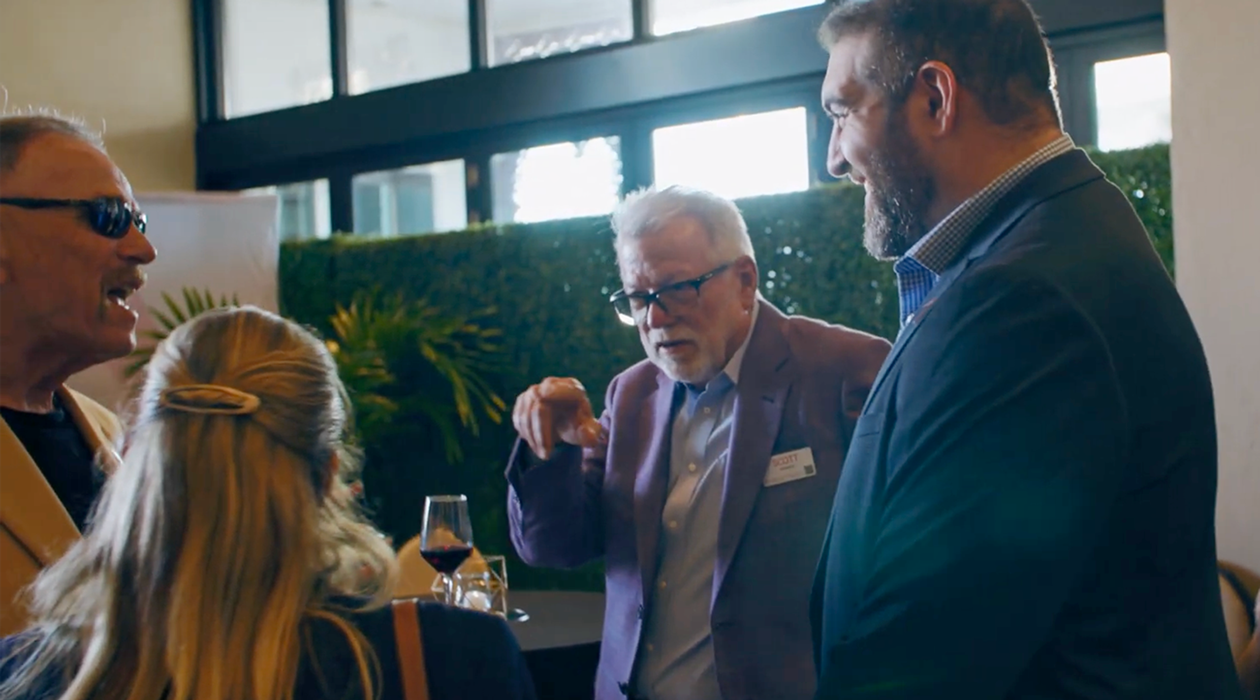 Group of colleagues talking at a PeakActivity event
