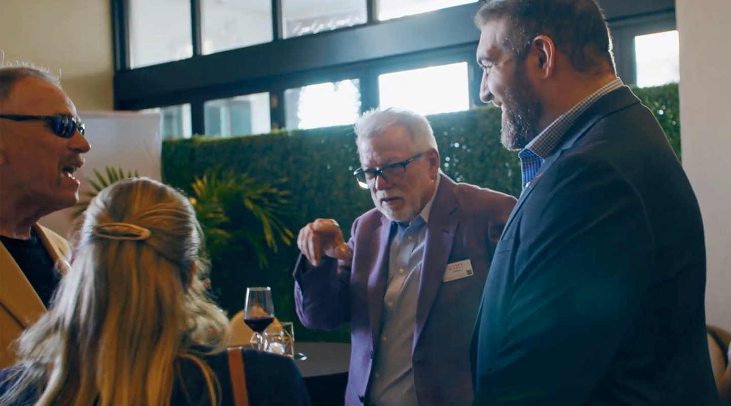 Group of colleagues talking at a PeakActivity event