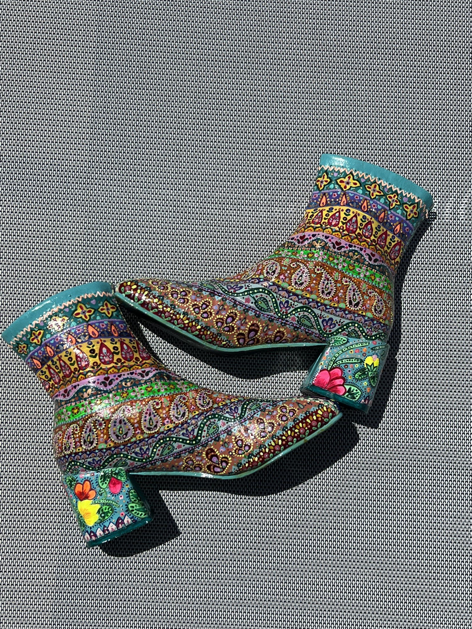 Hand-painted boots showing the patterned outer sides