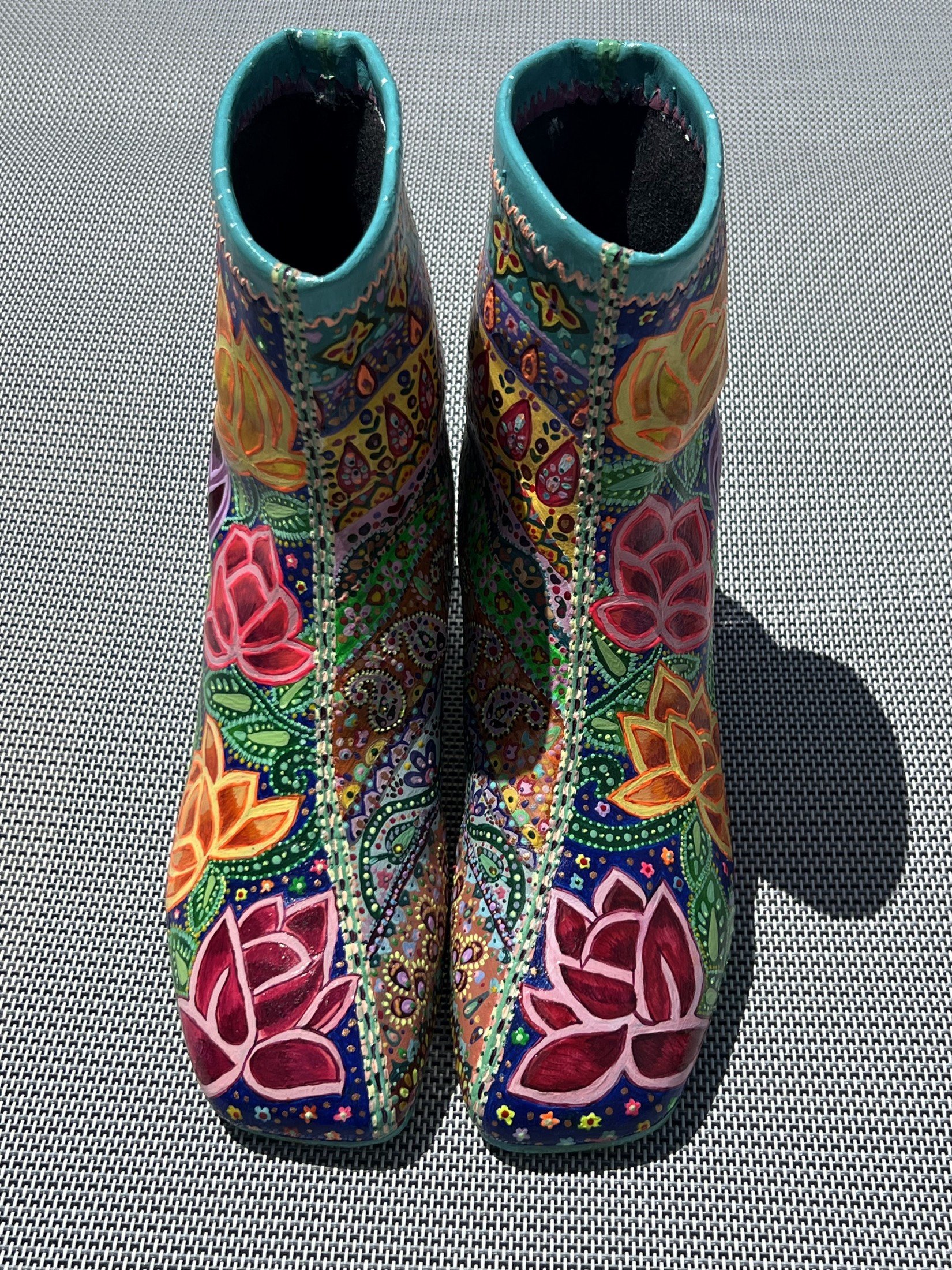 Front view of the hand-painted boots