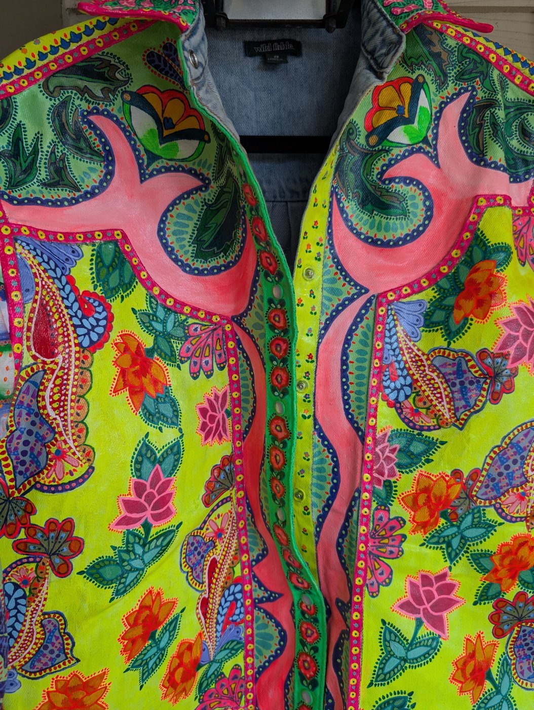 Front of the jacket with painted birds and flowers