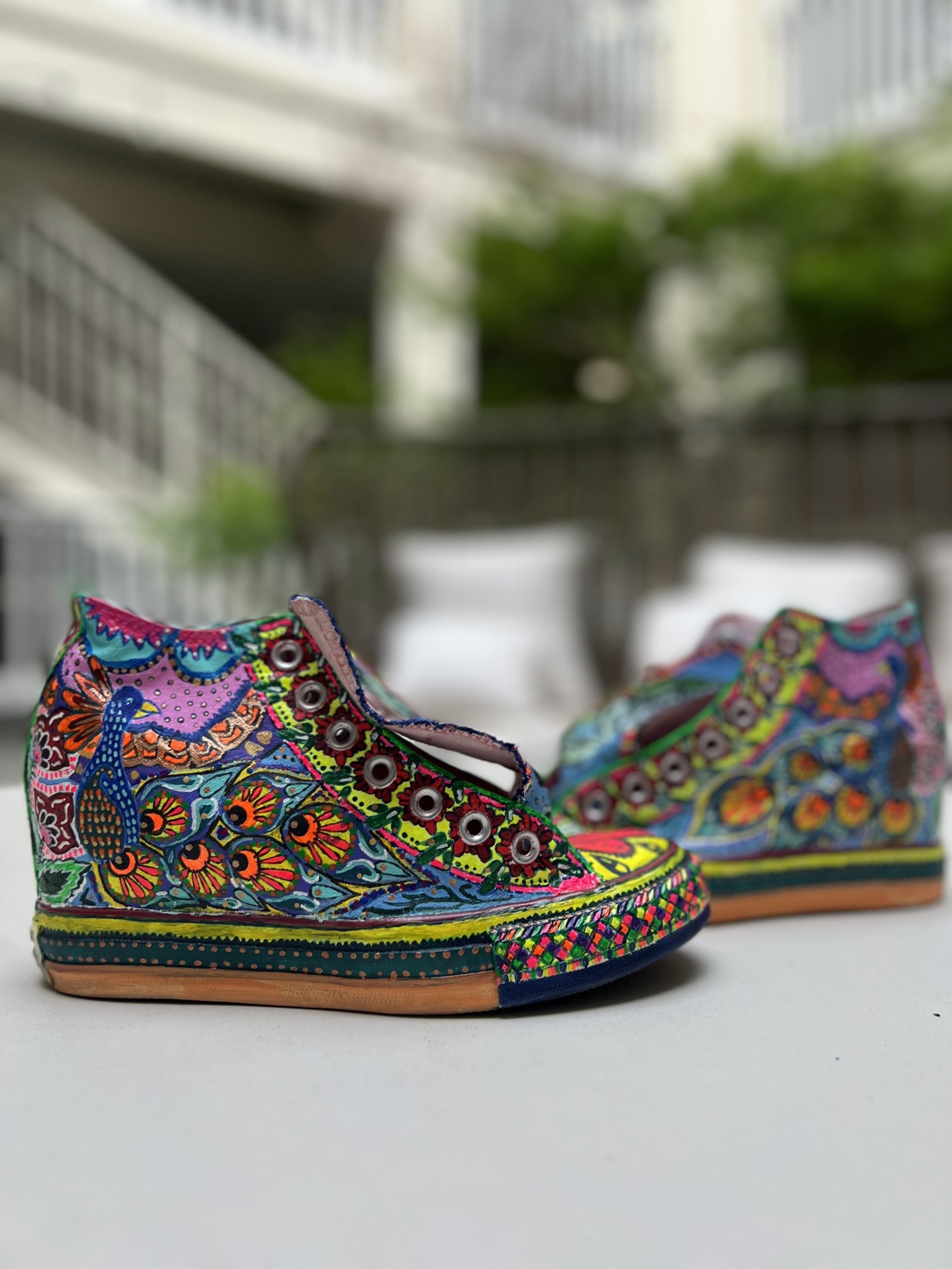 Side view of colorful hand-painted high tops