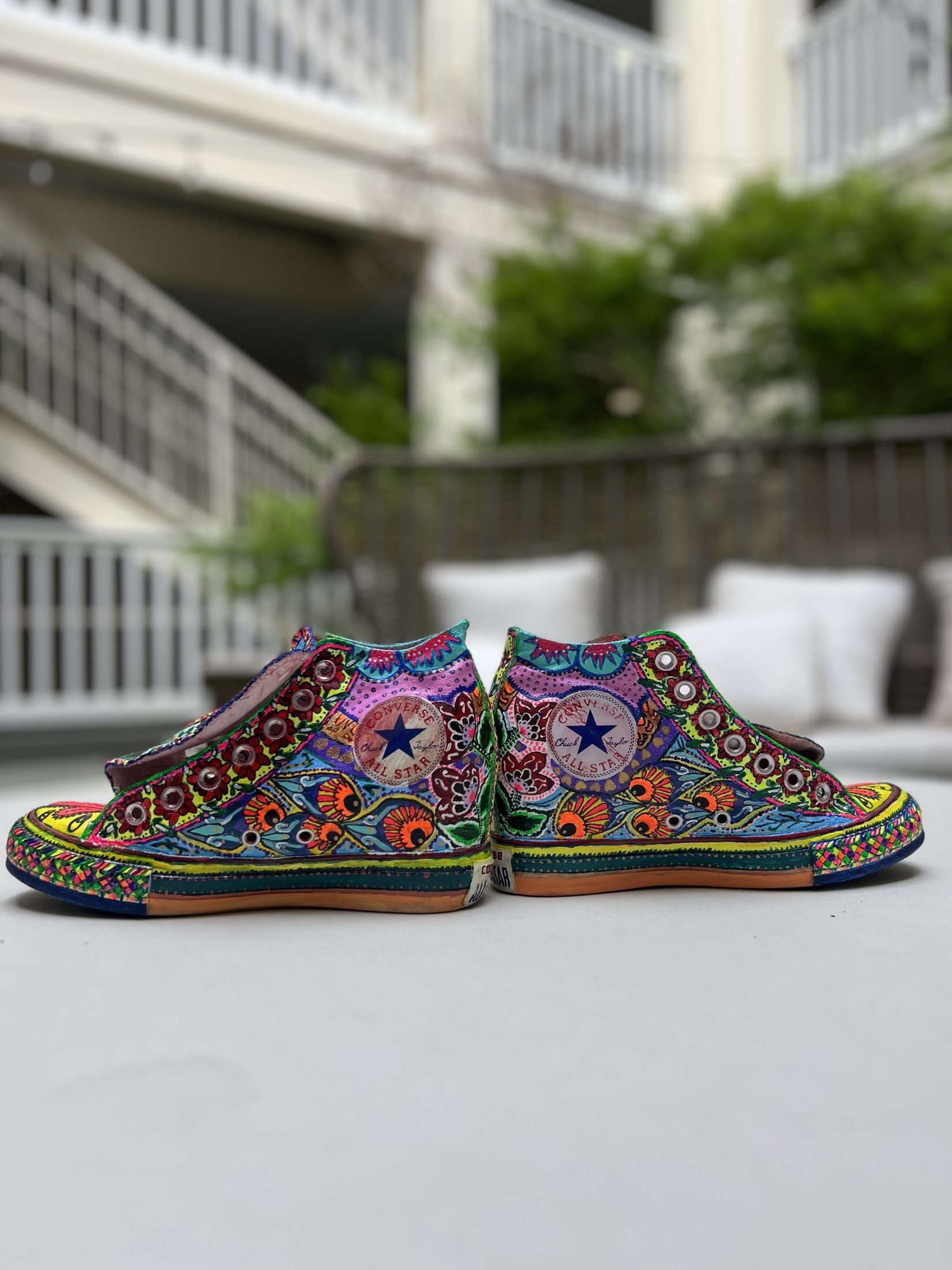Outer side of a hand-painted high top with flowers and stars