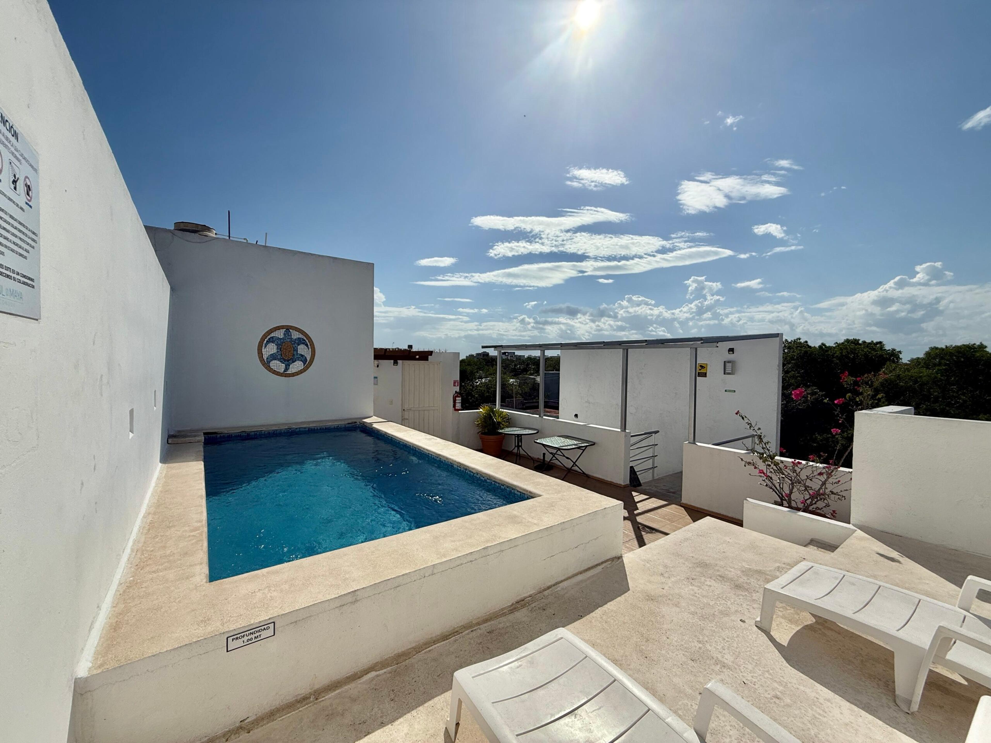 Azul Maya | Bright 2-Bedroom Condo with Rooftop Pool — photo 21