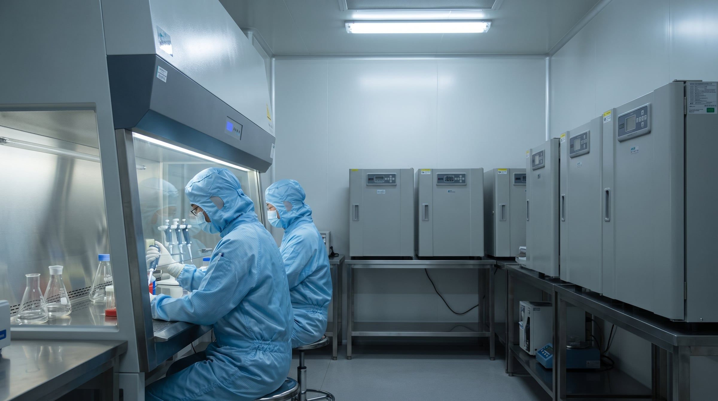 Cell processing laboratory with biosafety cabinets and monitoring equipment