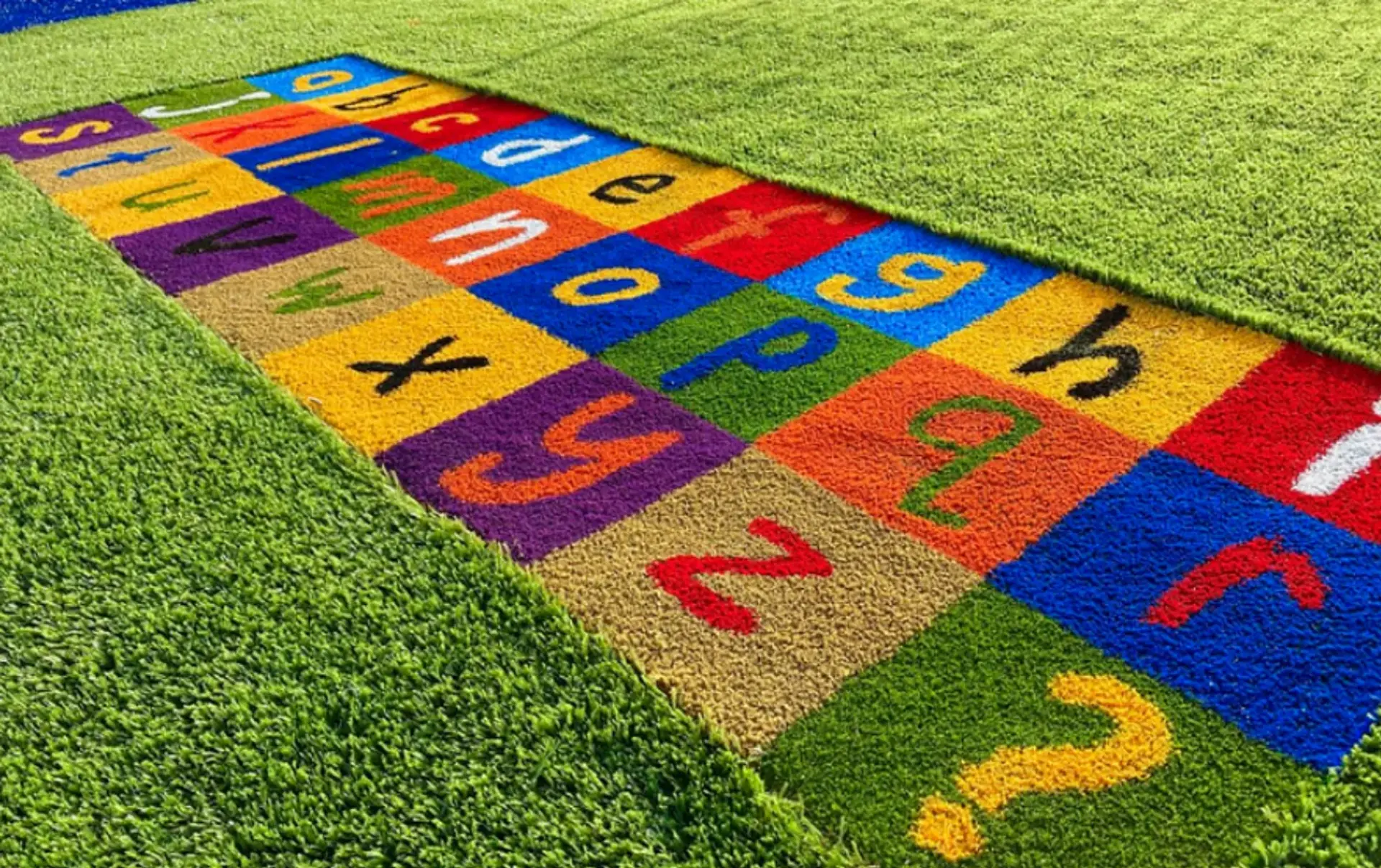 Synthetic playground grass surfacing installed by Westplay