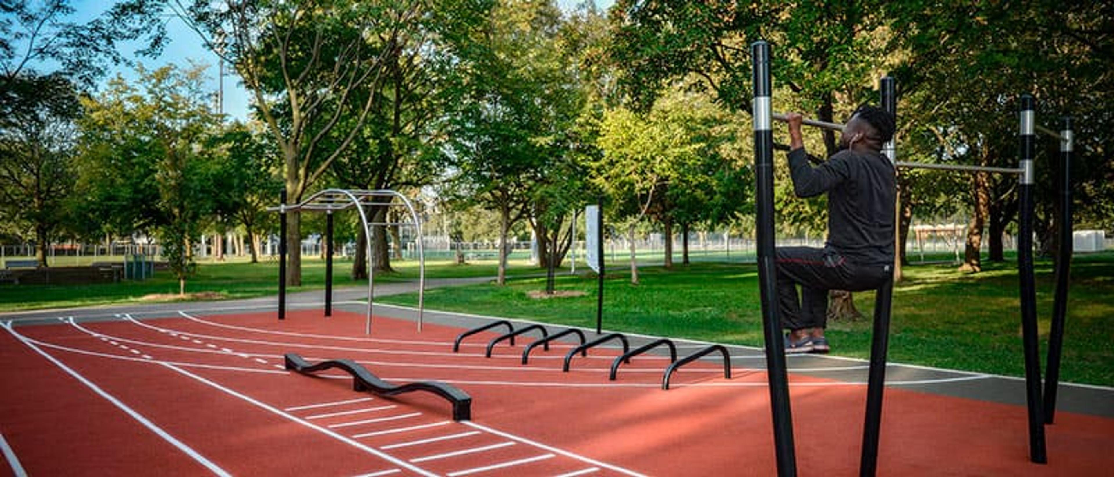 Outdoor fitness circuit with calisthenics bars in a public park