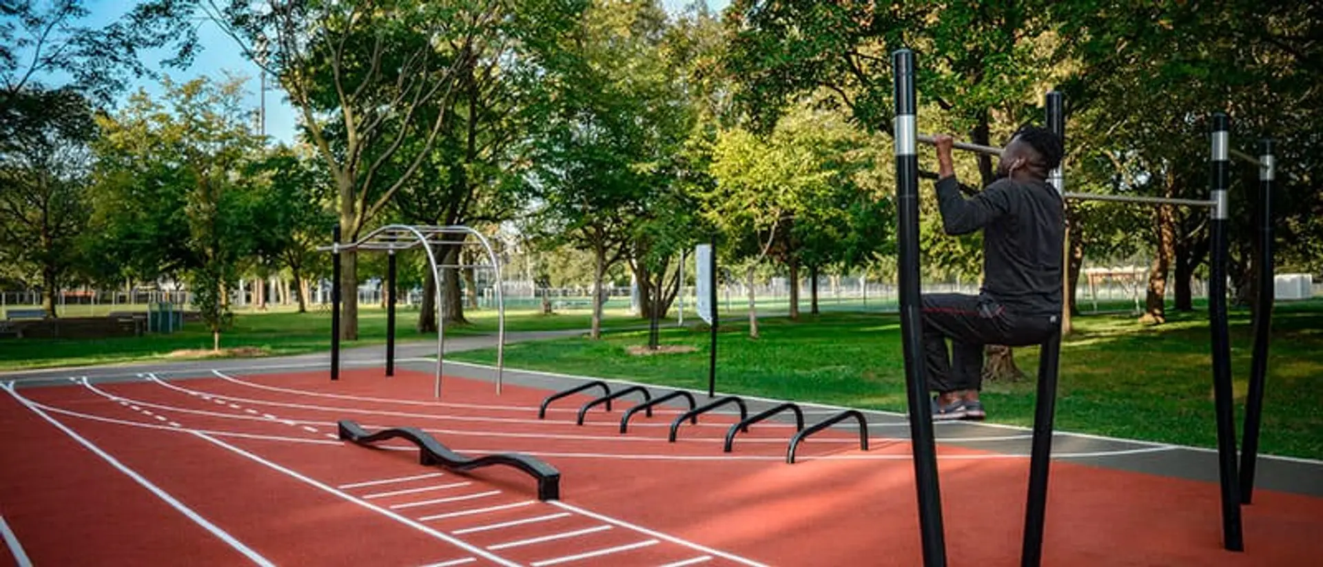 Outdoor fitness circuit with calisthenics bars in a public park