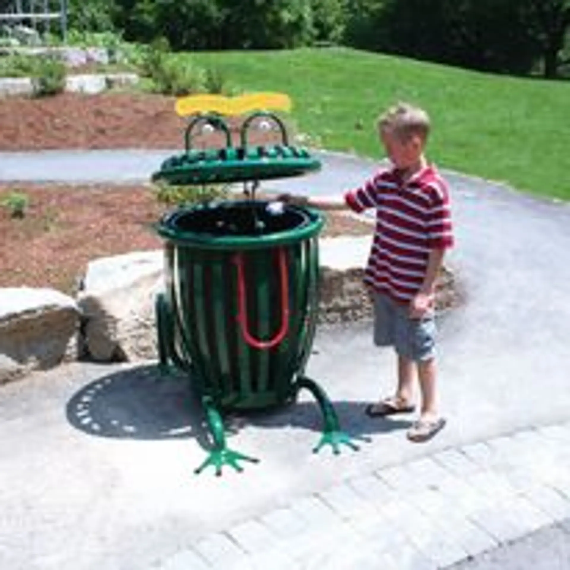Themed waste receptacle and site amenities installed in a community park