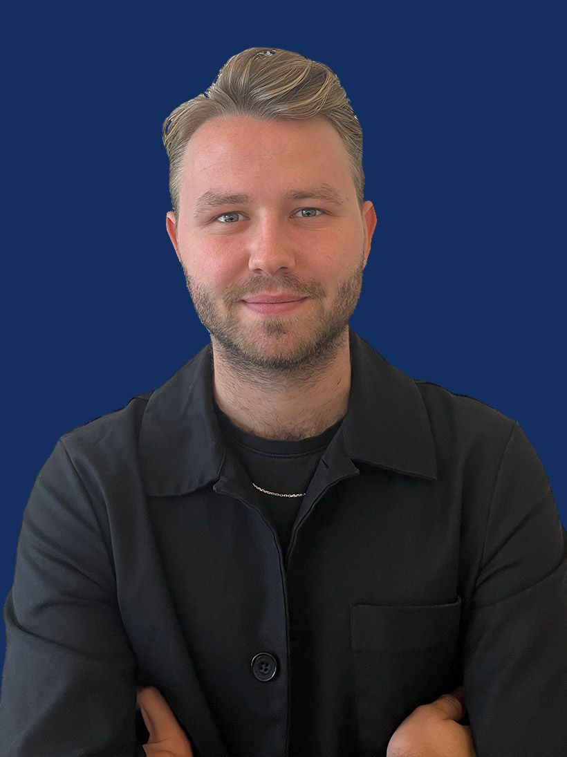 Football Travel Staff Member standing with arms crossed