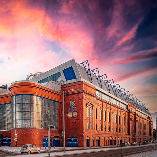 Ibrox seen from the outside with a beautiful sky and snowy streets