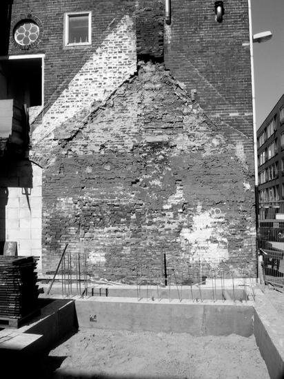 Black and white shot of worn brick wall