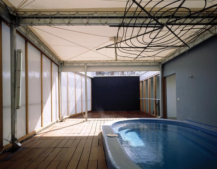 Color photo of third floor with the pool