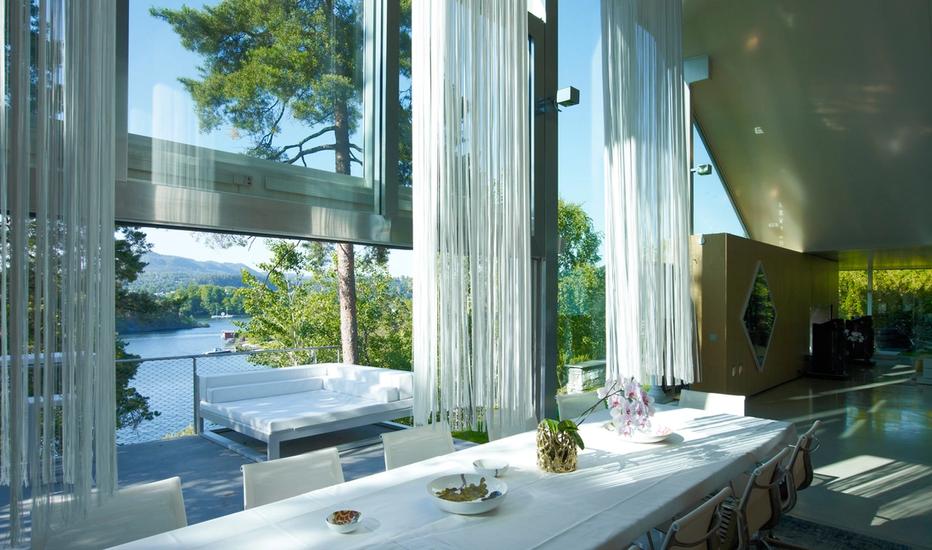 Interior shot where large glass windows opens up a beautiful view over the Oslo Fjord.