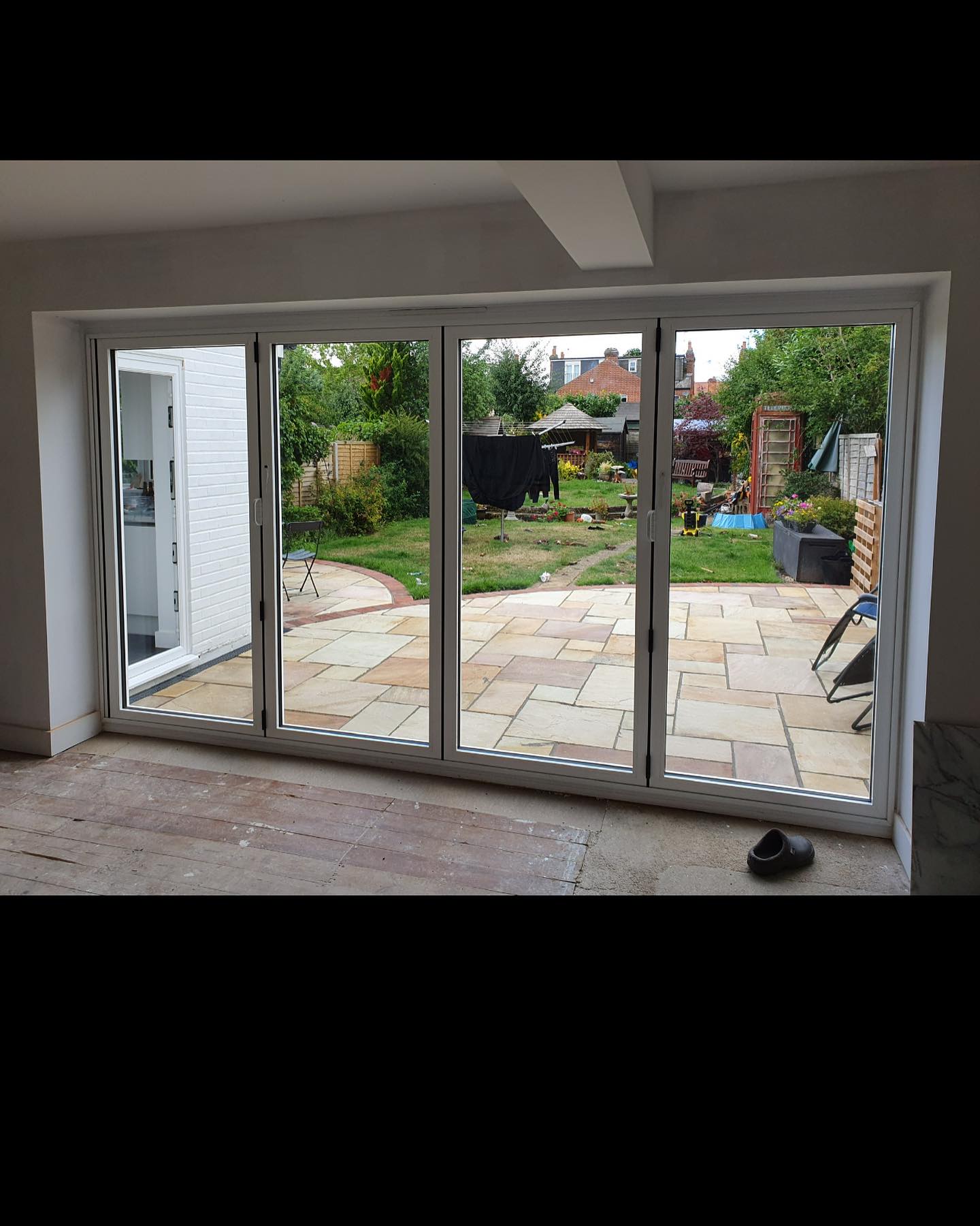 Completed installation of bifold doors and patio from inside in Caversham, Reading