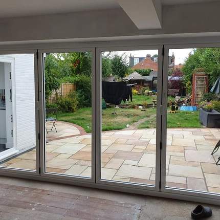 Completed installation of bifold doors and patio from inside in Caversham, Reading