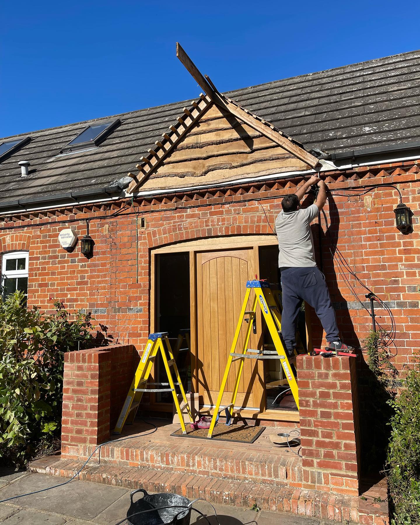 Matt Tanner wiring new porch canopy