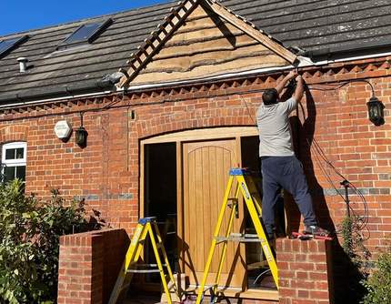 Matt Tanner wiring new porch canopy