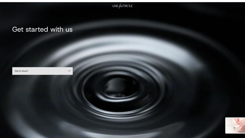Une Autre Île Productions website: “Get started with us” over black and white ripples on water