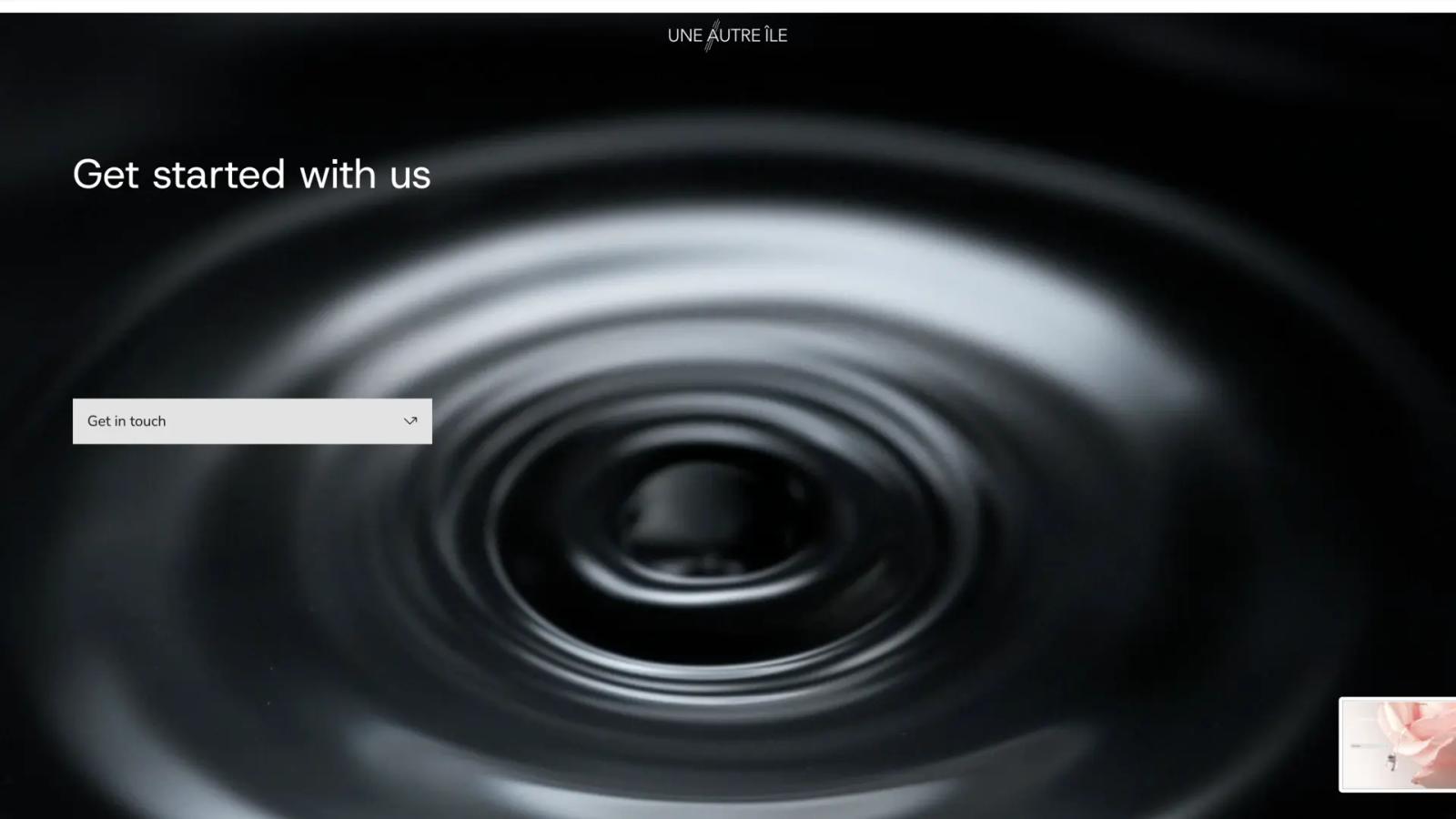 Une Autre Île Productions website: “Get started with us” over black and white ripples on water