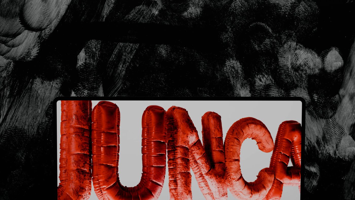 The Junca logo as red inflated 3D letters on a laptop screen, against a black and white brushstroke wall