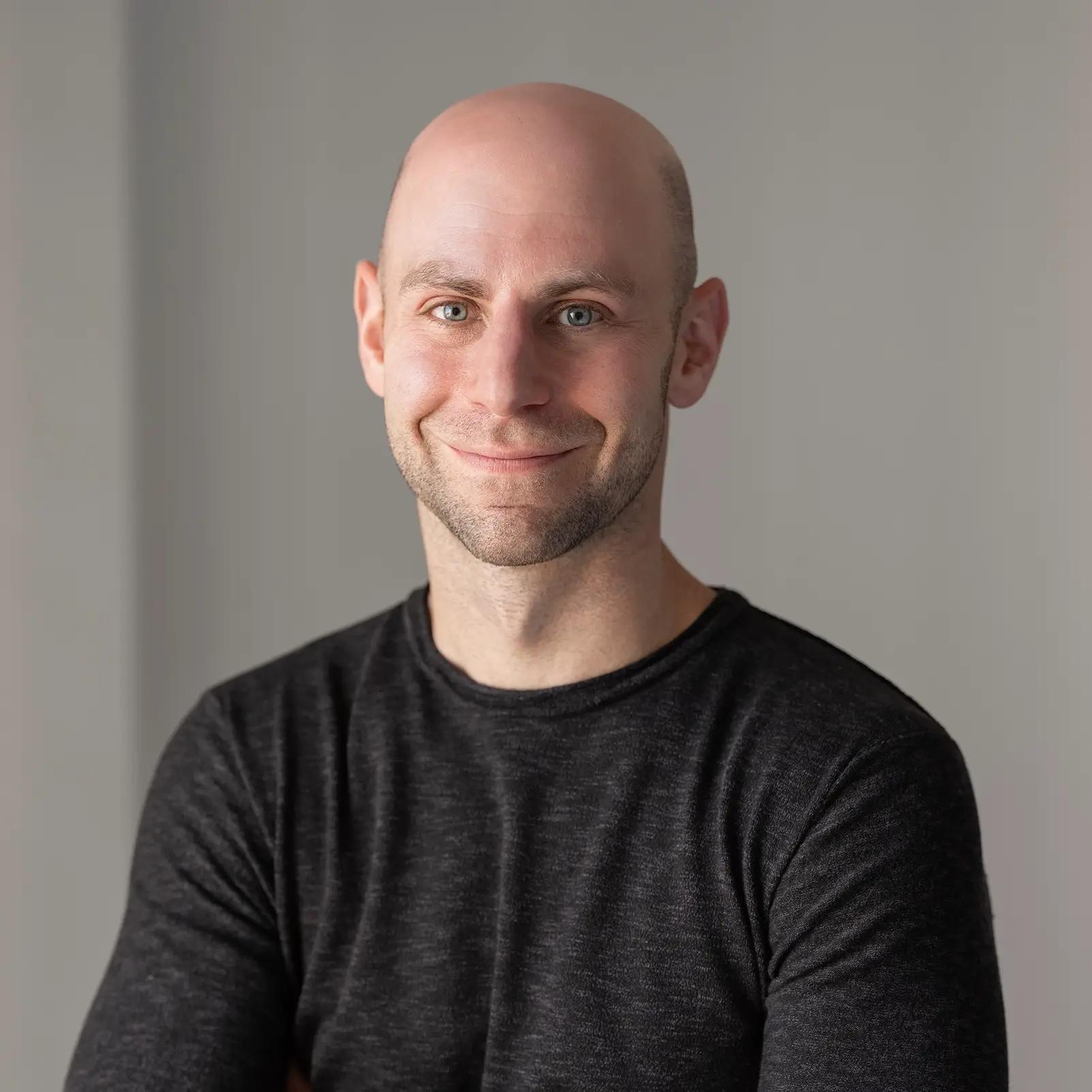 Headshot of author Adam Grant