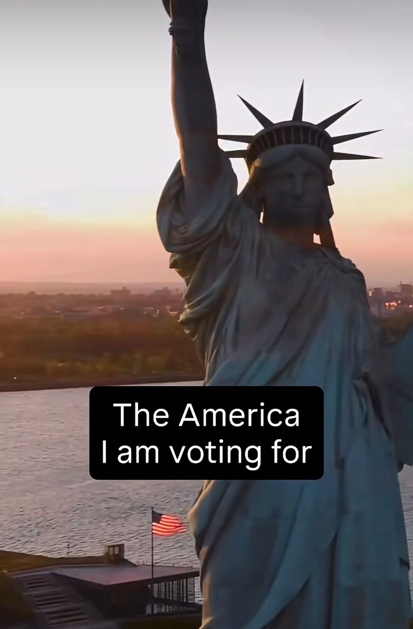 The Statue of Liberty at dusk, with the words “The America I am voting for.”