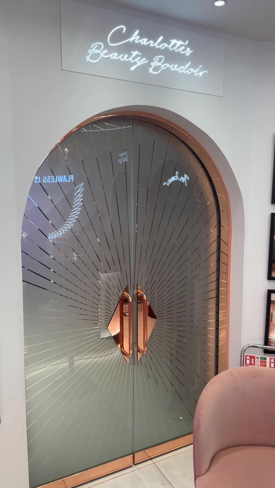 Bespoke processed glass doors within the Charlotte Tilbury retail fit-out