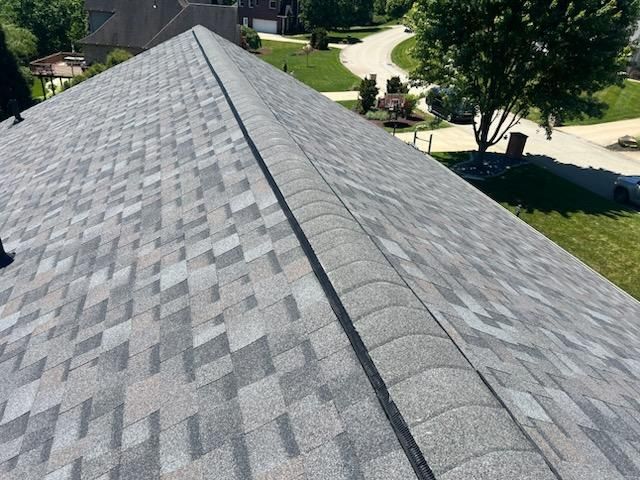 Ridge vent running along a finished roof