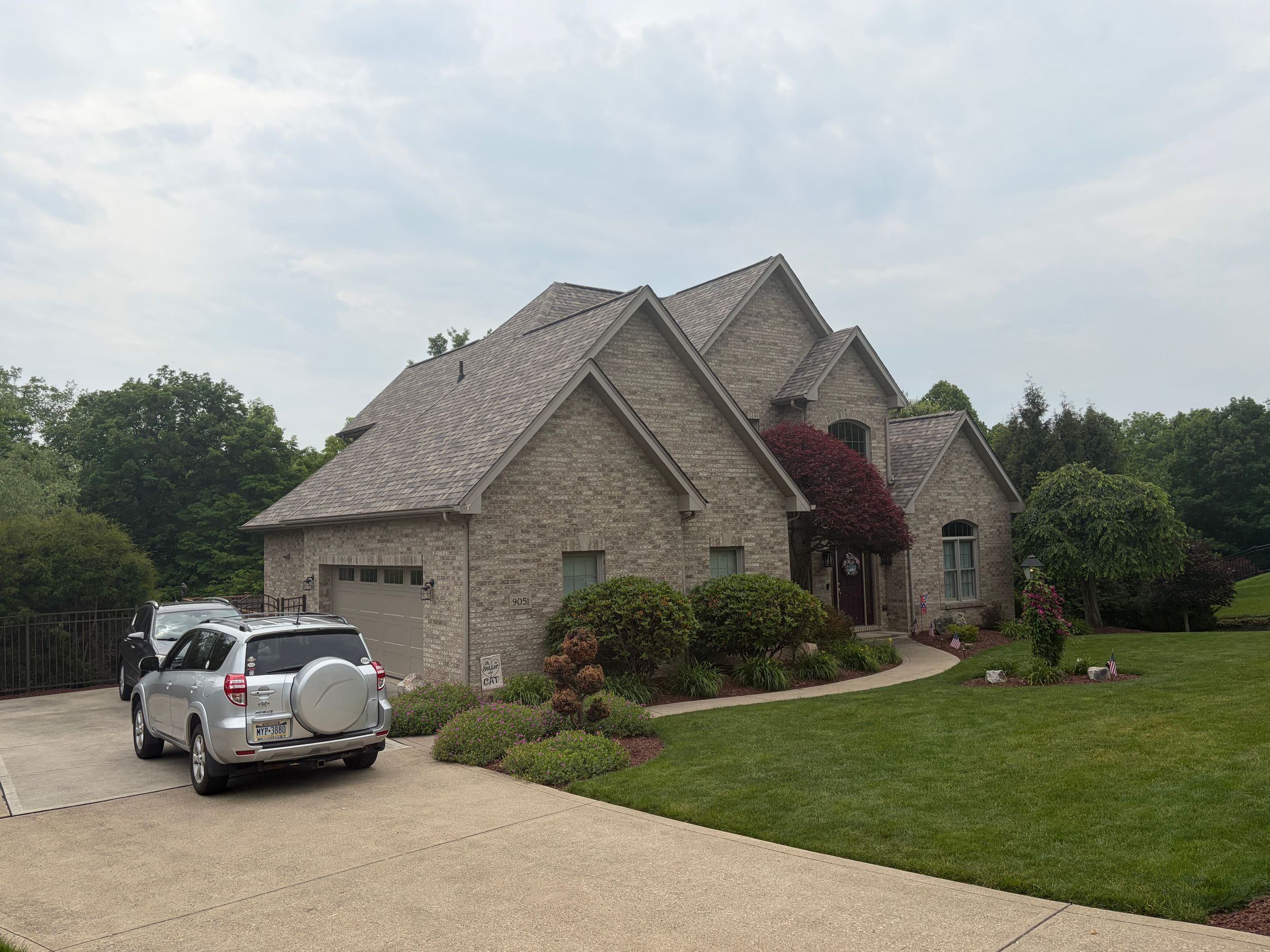Brick home with finished roof, soffit and fascia
