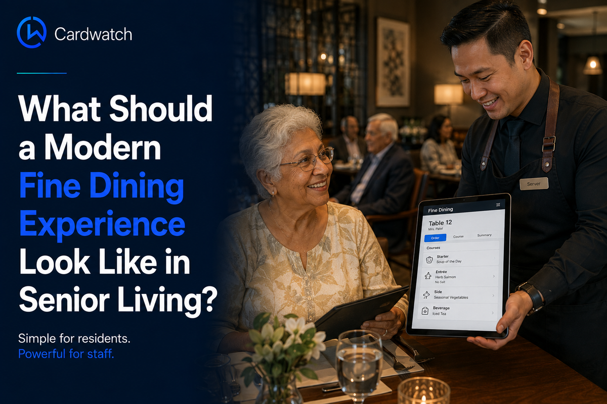 A server presents a tablet showing a fine dining order screen to a smiling senior resident in an upscale community dining room.