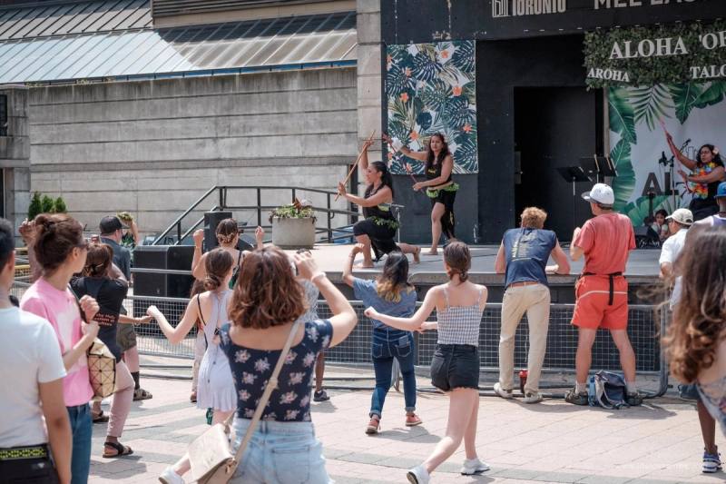 A hula hālau dancing at Mel Lastman Square