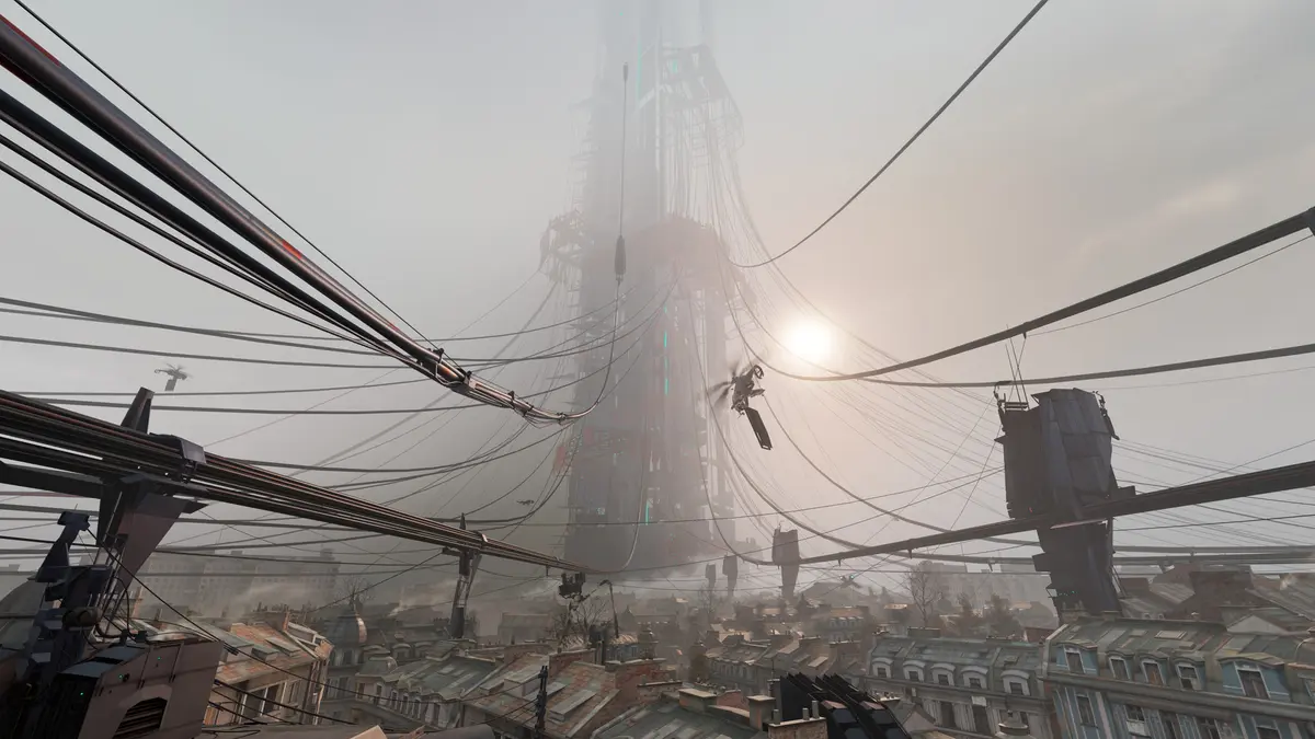 The City 17 skyline from Half-Life: Alyx seen from a rooftop, with cables and gondolas strung across the view in front of the towering Citadel.