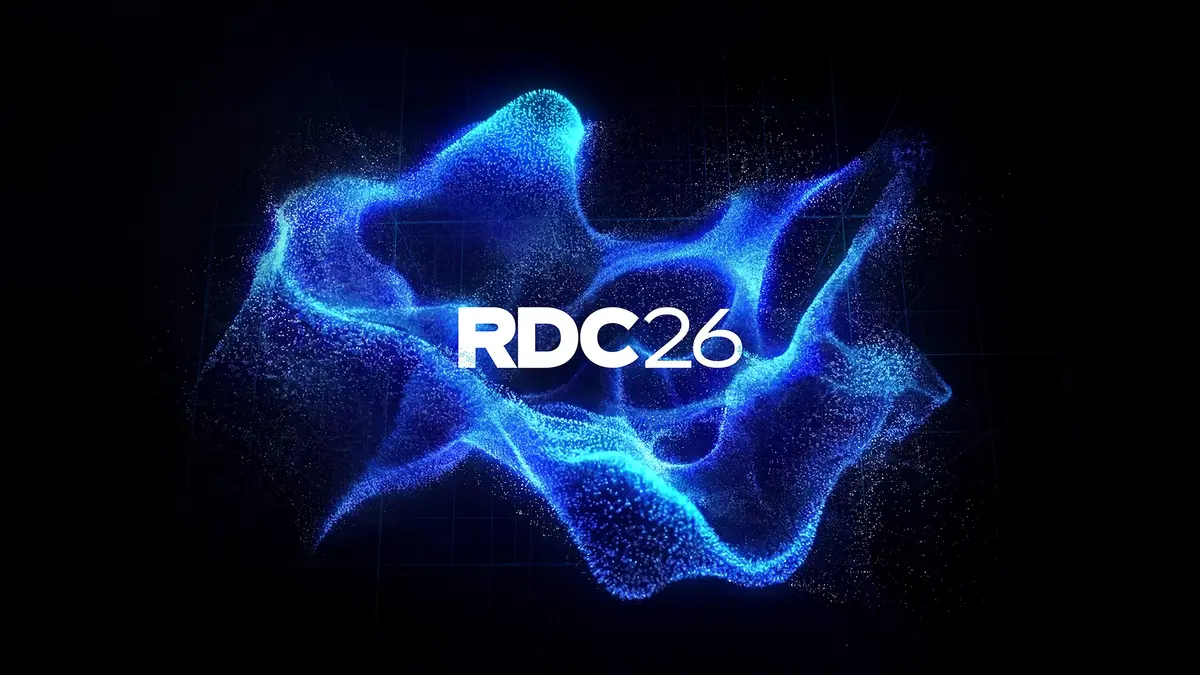 Roblox Developers Conference 2026 key art with the RDC26 wordmark on a blue particle background
