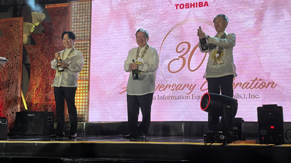 A speaker at a Toshiba-branded podium during the 30th anniversary ceremony for Toshiba Information Equipment (Philippines) in Manila
