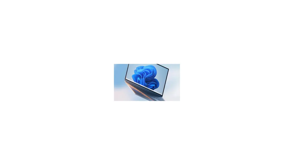 A silver Windows 11 laptop floating at an angle against a blue gradient background, its screen showing the light blue Bloom wallpaper