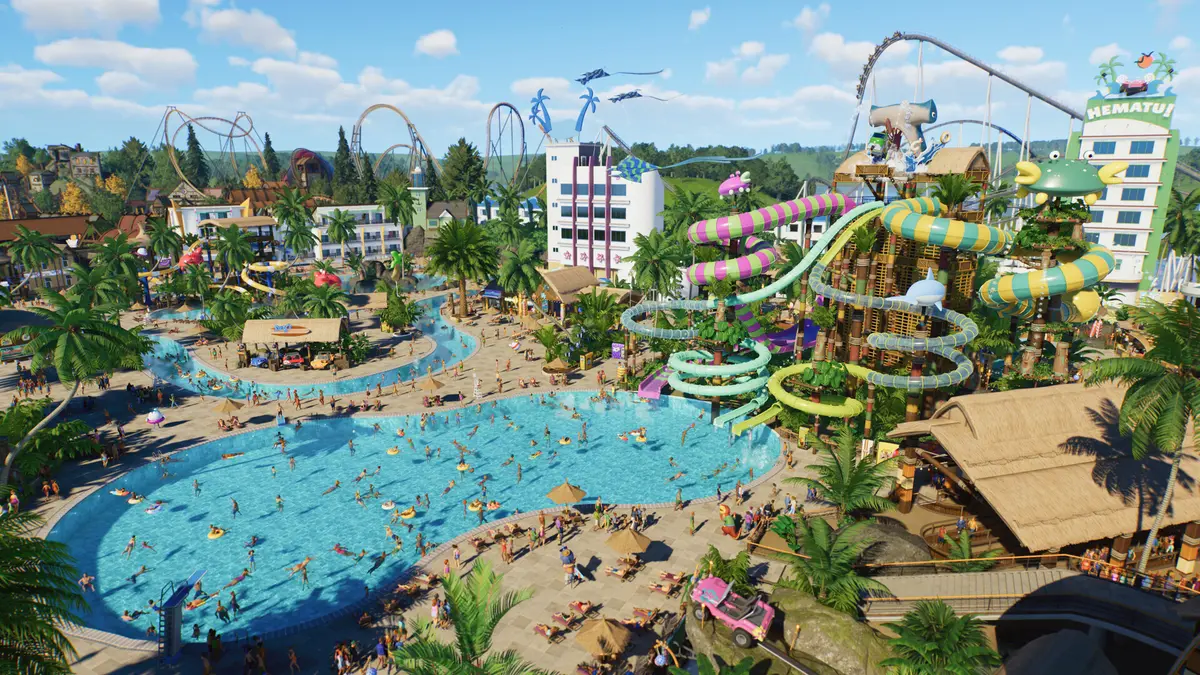 A colourful rollercoaster loops through a busy Planet Coaster theme park with guests queueing beneath, as seen in Frontier Developments’ official Planet Coaster screenshot.
