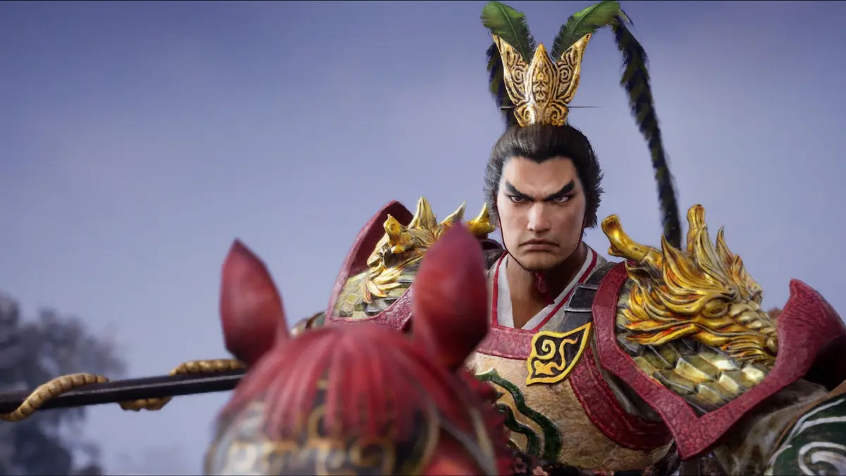 An officer in the Dynasty Warriors 3 remaster, shown in close-up in ornate gold and green armour with a feathered headdress.