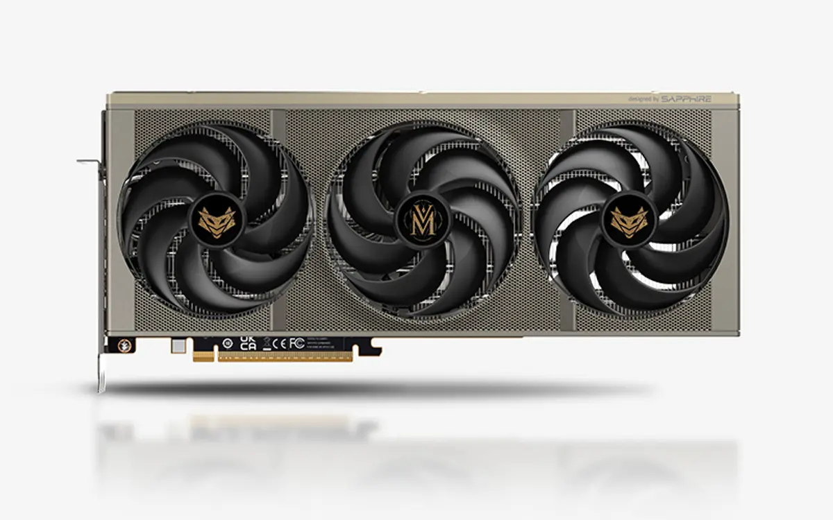 A Sapphire Nitro+ Radeon RX 9070 XT graphics card photographed at three-quarters angle, its three fans and textured shroud filling the centre of the frame