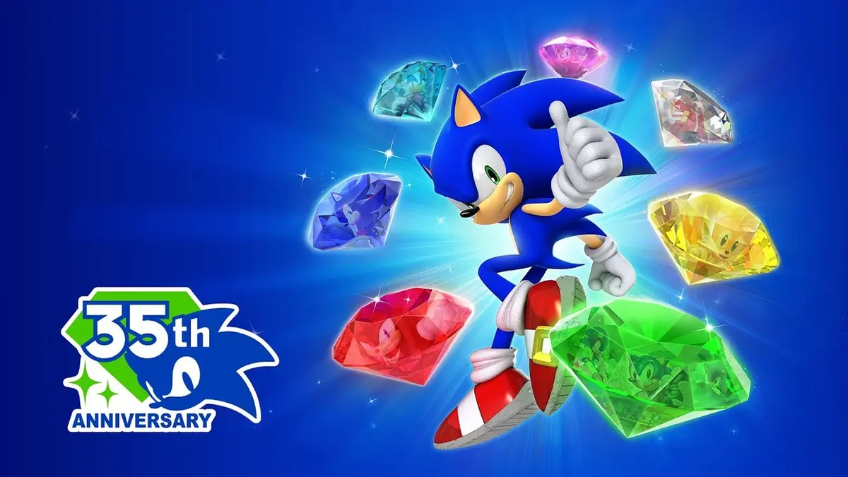 SEGA's official Sonic the Hedgehog 35th anniversary key art: Sonic runs forward with one thumb raised against a deep blue background while the seven Chaos Emeralds float around him, each one reflecting a classic Sonic game, with the 35th ANNIVERSARY mark in the lower left