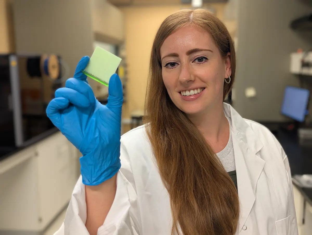 University of Waterloo professor Maxime van der Heijden holding a 3D-printed porous structure designed to become a redox flow battery electrode.